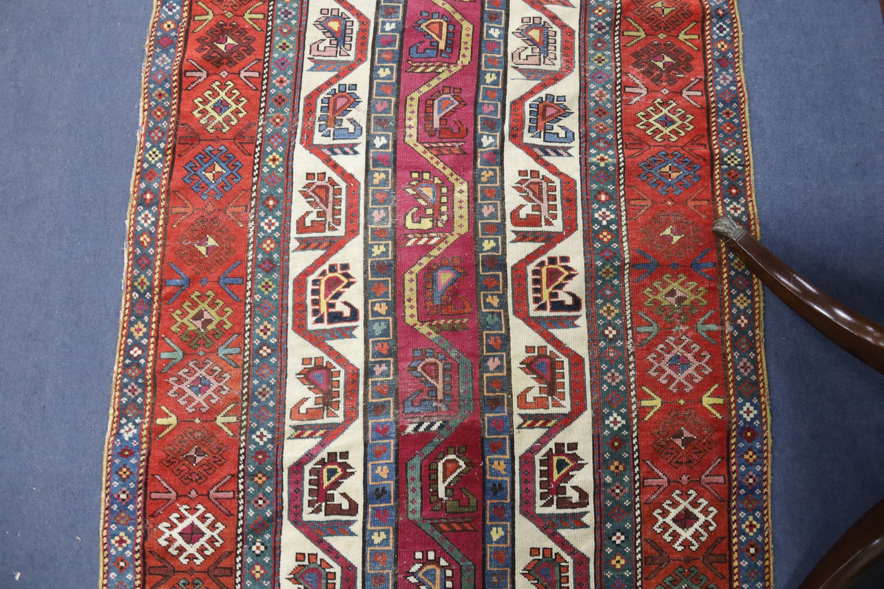 A Caucasian geometric rug, 284 x 118cm